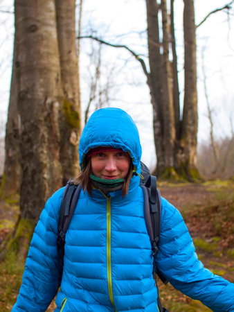 Portrait of a girl in a hood and scarf.