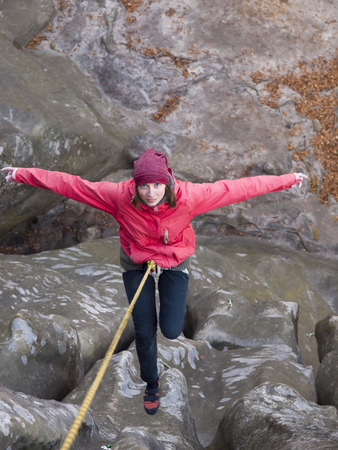 A young climber climbs on the vertical wall.の写真素材