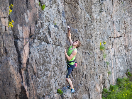 A man has been climbing on the rocks and enjoy life.の写真素材