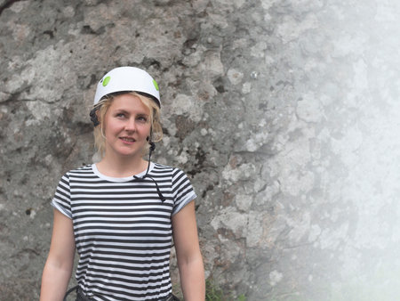 Portrait of a girl rock climbers in the helmet for safety.の写真素材