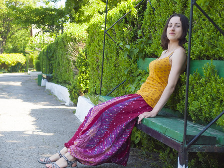 Young and beautiful girl dressed in Oriental style fun in the Park.の写真素材