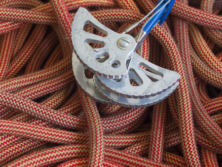 Equipment for climbing in the mountains is on the orange rope.の写真素材