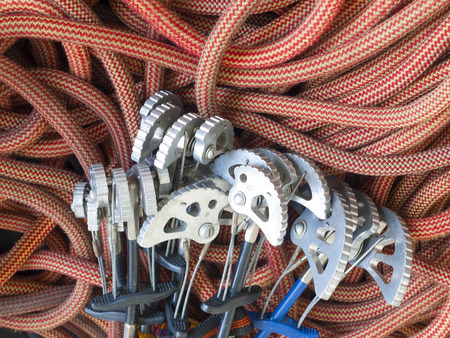 Equipment for climbing in the mountains is on the orange rope.の写真素材