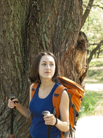 A young girl with a backpack and went on a tourist trip.の写真素材