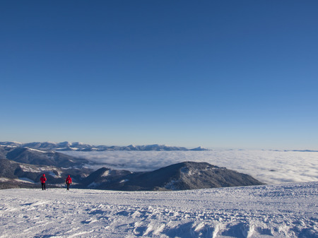 People look at the snowy mountains and have fun.の写真素材
