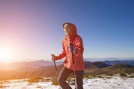 The girl is engaged in sports in the mountains.の写真素材