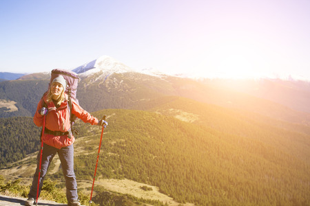 Climber with a backpack is on a slope.の写真素材