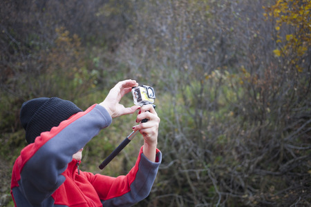 Girl makes a music video about the adventures.の写真素材