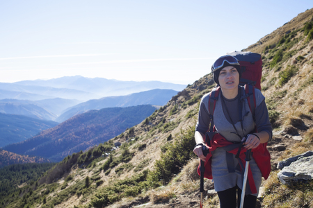 A woman goes to the top of the mountain.の写真素材