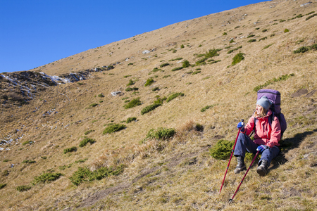 Active woman is traveling with a backpack.の写真素材
