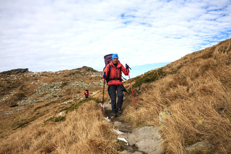 The girls go on a Hiking trail with backpacks.の写真素材