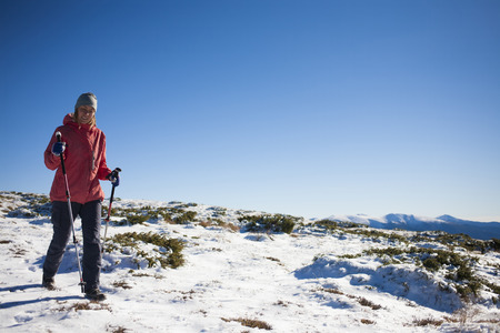 The girl is engaged in sports in the mountains.の写真素材