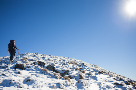 Two women climbers are climbing the mountain.の写真素材