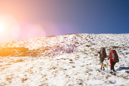 Two sports girls do Hiking in the mountains.の写真素材