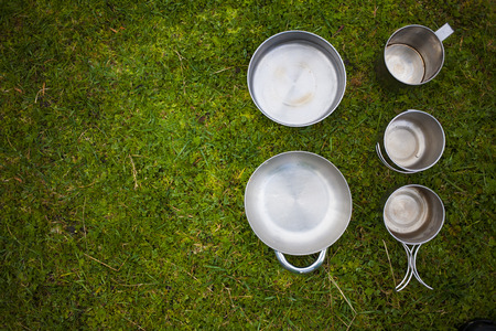 Metallic utensils standing on the green grass.の写真素材