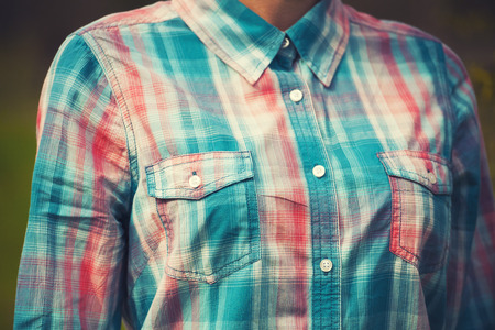 Plaid shirt on a girl with a good figure.の写真素材