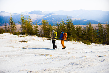 A group of climbers going to the top of the mountain during the winter.の写真素材