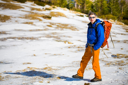 Portrait of climber on a background of mountains on a winter day.の写真素材