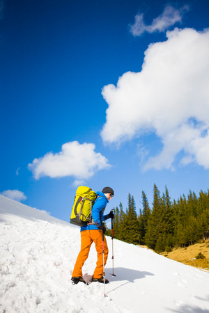 Portrait of climber on a background of mountains on a winter day.の写真素材