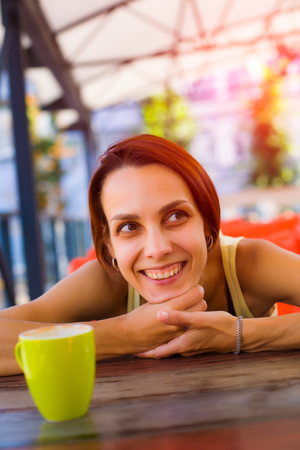 Portrait of a girl sitting in a coffee shop.の写真素材