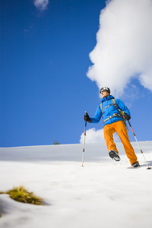Portrait of climber on a background of mountains on a winter day.の写真素材