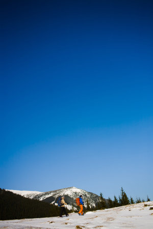 A group of climbers going to the top of the mountain during the winter.