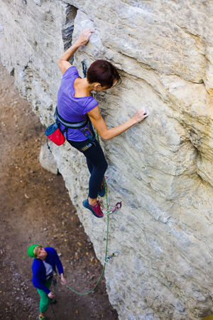 Two friends have been climbing on the rocks and fun to spend time.の写真素材