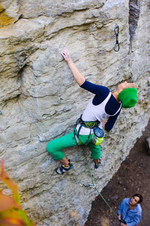 Two friends have been climbing on the rocks and fun to spend time.の写真素材
