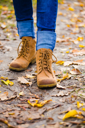 Dirty boots after a walk through the woods in the fall.の写真素材
