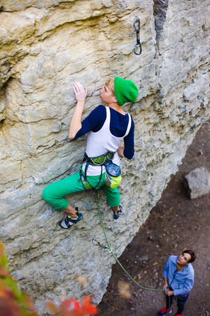 Two friends have been climbing on the rocks and fun to spend time.の写真素材