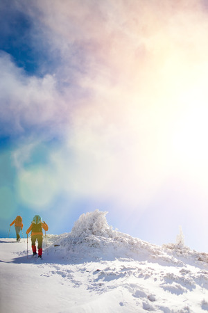 tourists walk in the snow in the mountains during the winter holidays in the mountains, winter in the Ukrainian Carpathians.
の写真素材