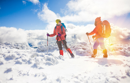 tourists walk in the snow in the mountains during the winter holidays in the mountains, winter in the Ukrainian Carpathians.
の写真素材