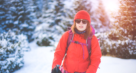 girl with a backpack in the woods, travel and sports.の写真素材