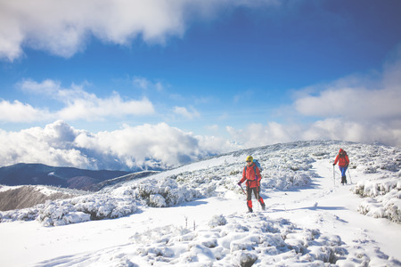 tourists walk in the snow in the mountains during the winter holidays in the mountains, winter in the Ukrainian Carpathians.
の写真素材