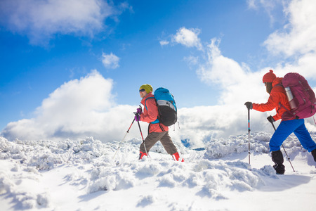 tourists walk in the snow in the mountains during the winter holidays in the mountains, winter in the Ukrainian Carpathians.
の写真素材