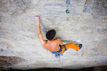 rock climber climbs the cliff using ropes and equipment, the employment of sports climbing.の写真素材