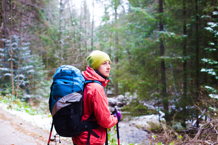 girl with a backpack in the woods, travel and sports.の写真素材