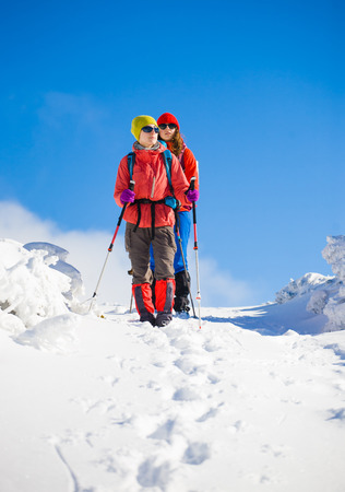 tourists walk in the snow in the mountains during the winter holidays in the mountains, winter in the Ukrainian Carpathians.
の写真素材