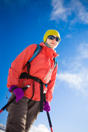 portrait of a girl climber in glasses, winter holidays in the mountains.の写真素材