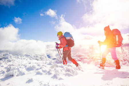 tourists walk in the snow in the mountains during the winter holidays in the mountains, winter in the Ukrainian Carpathians.
の写真素材