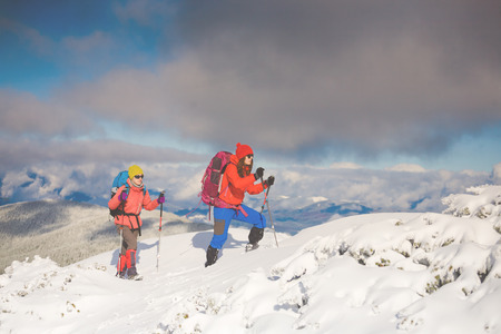 tourists walk in the snow in the mountains during the winter holidays in the mountains, winter in the Ukrainian Carpathians.
の写真素材