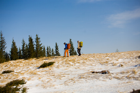 Tourists Hiking in the mountains during the winter.の写真素材