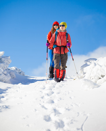 tourists walk in the snow in the mountains during the winter holidays in the mountains, winter in the Ukrainian Carpathians.
の写真素材