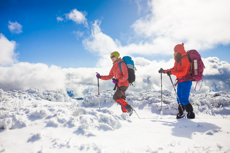 tourists walk in the snow in the mountains during the winter holidays in the mountains, winter in the Ukrainian Carpathians.
の写真素材