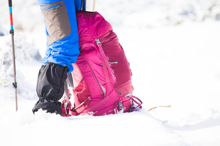 the backpack is near the tourist during the holidays, winter adventures in the mountains.の写真素材