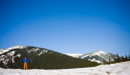 A group of climbers going to the top of the mountain during the winter.の写真素材