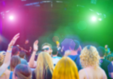 People having fun at the concert. The blur effect.の写真素材
