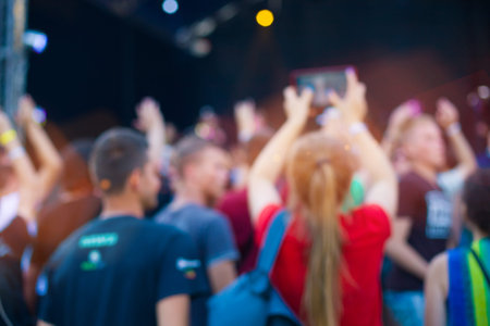 People having fun at the concert. The blur effect.の写真素材