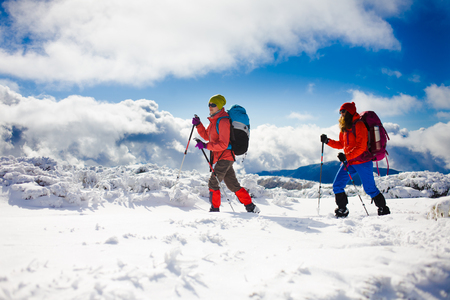 tourists walk in the snow in the mountains during the winter holidays in the mountains, winter in the Ukrainian Carpathians.
の写真素材