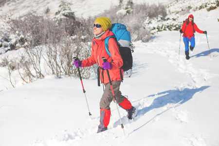 tourists walk in the snow in the mountains during the winter holidays in the mountains, winter in the Ukrainian Carpathians.
の写真素材
